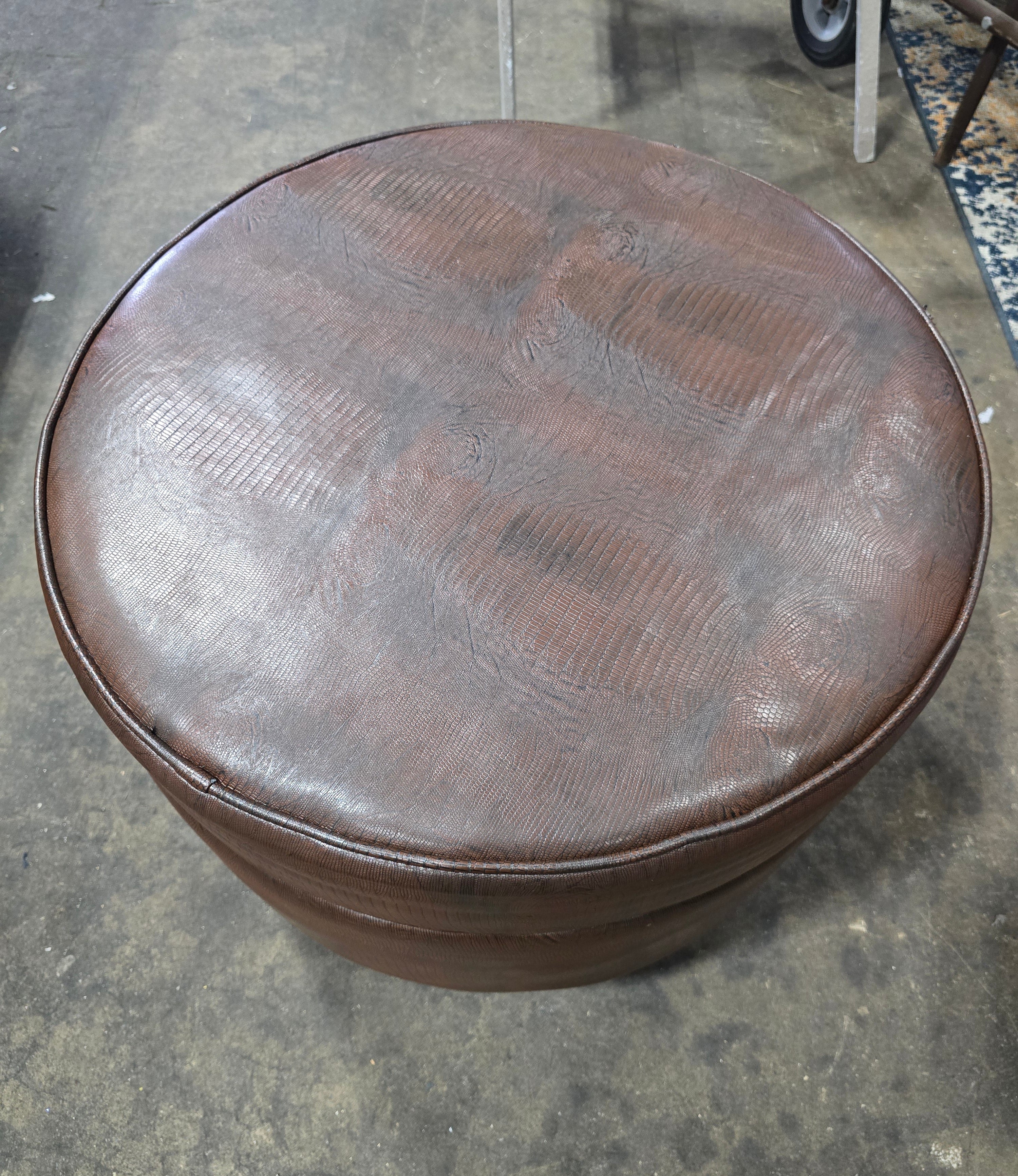 Brown round ottoman used in good condition