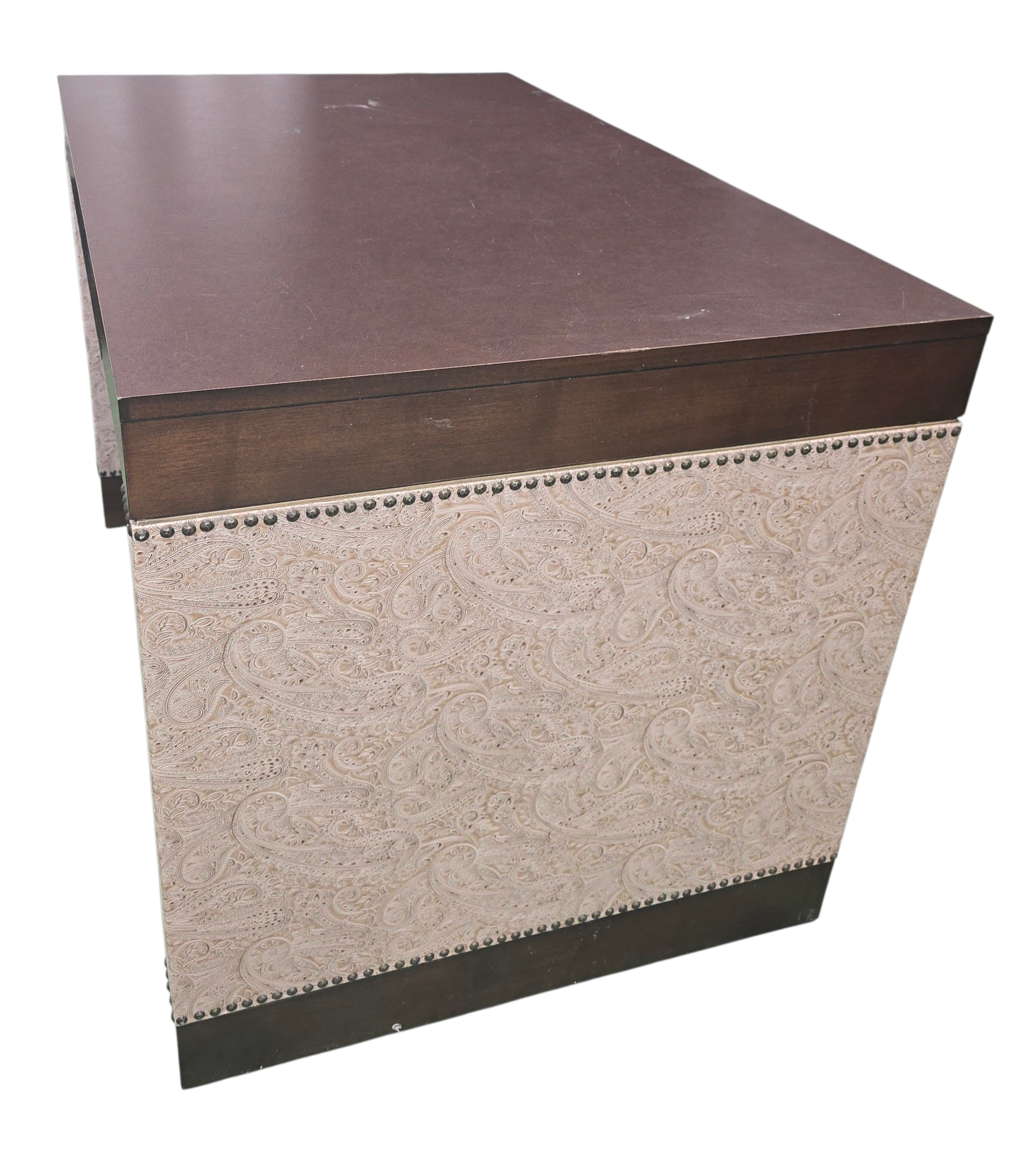 Close-up of paisley design detail on beige desk
