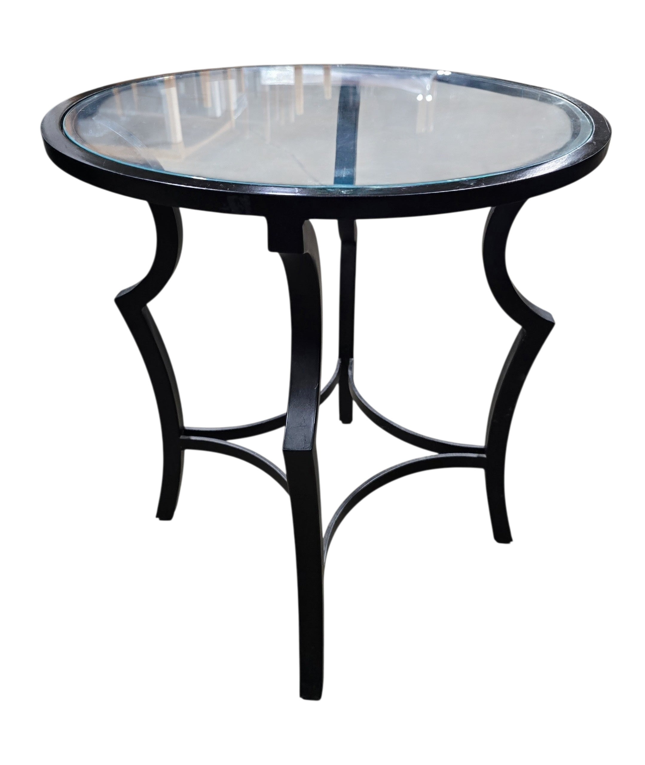 SHL used round glass top accent table with decorative black metal base sourced from an upscale resort