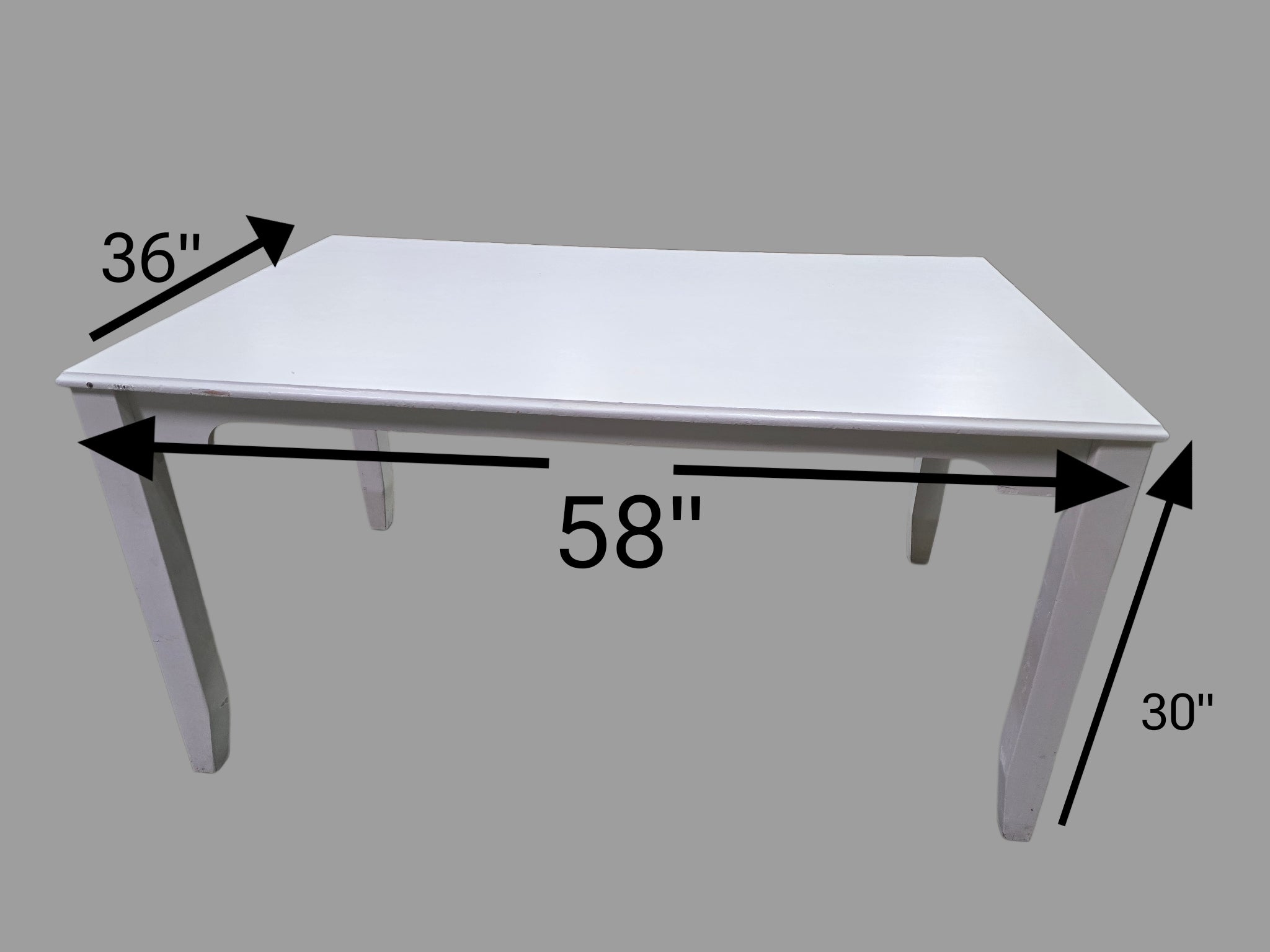 “White wood dining table, used resort furniture from Grand Palms Resort, 58 x 36 x 30”