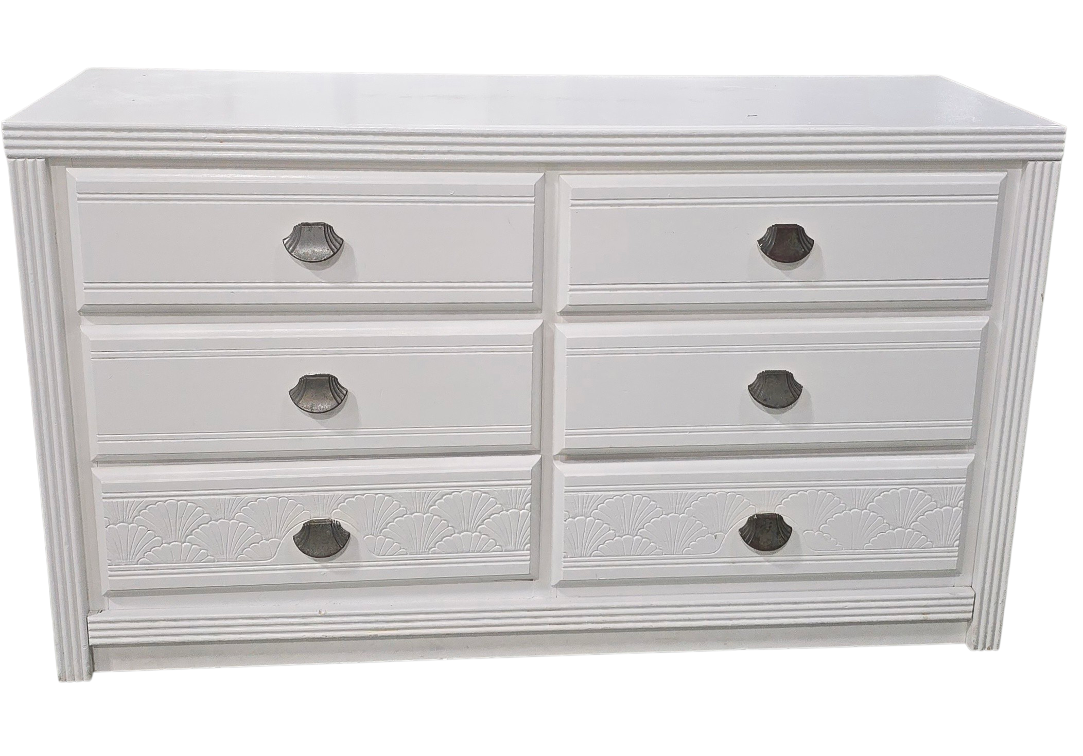 Front view of white dresser with shell shaped drawer pulls