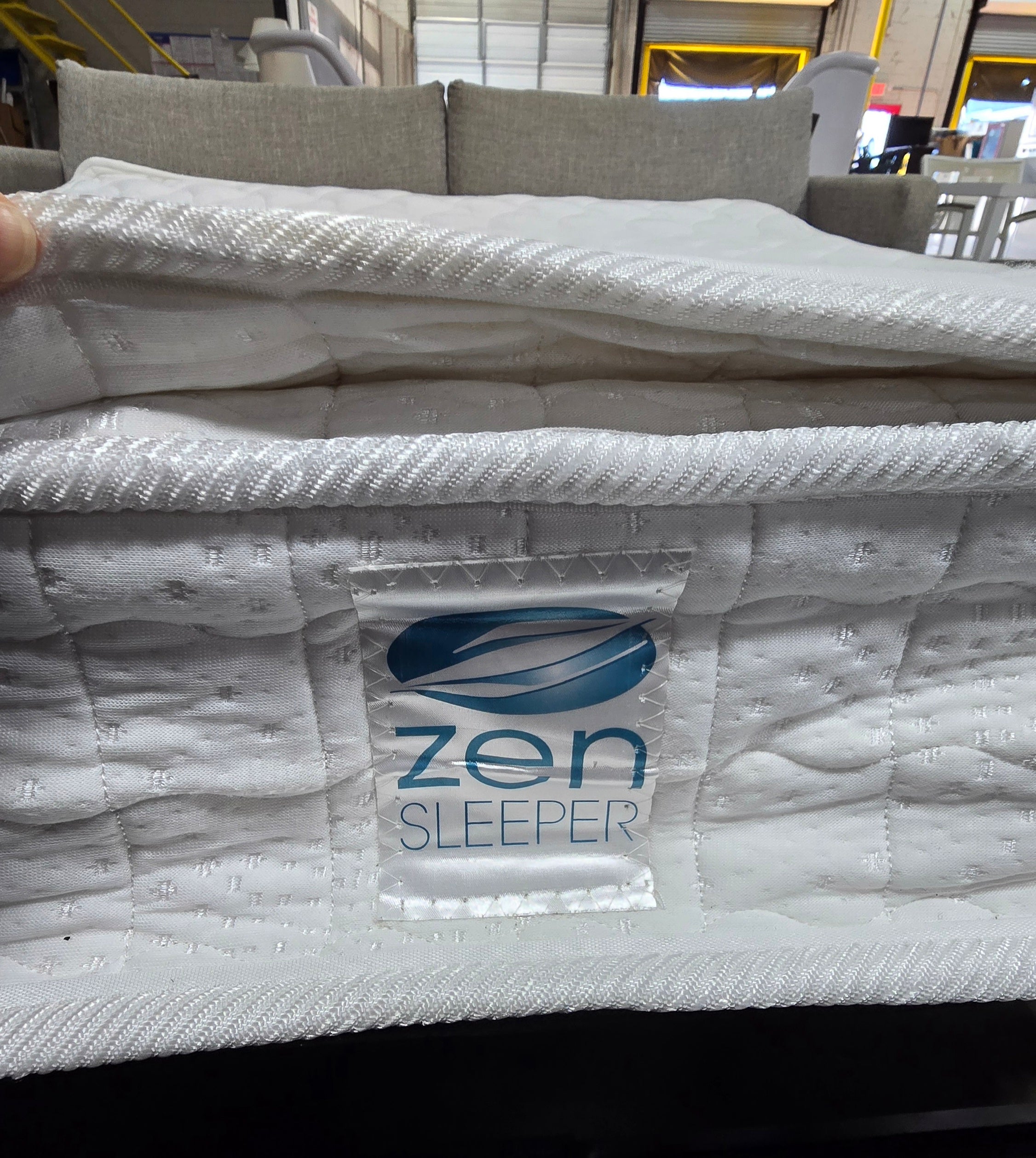 SHL close-up of Zen brand pillow top mattress inside Kellex sleeper sofa
