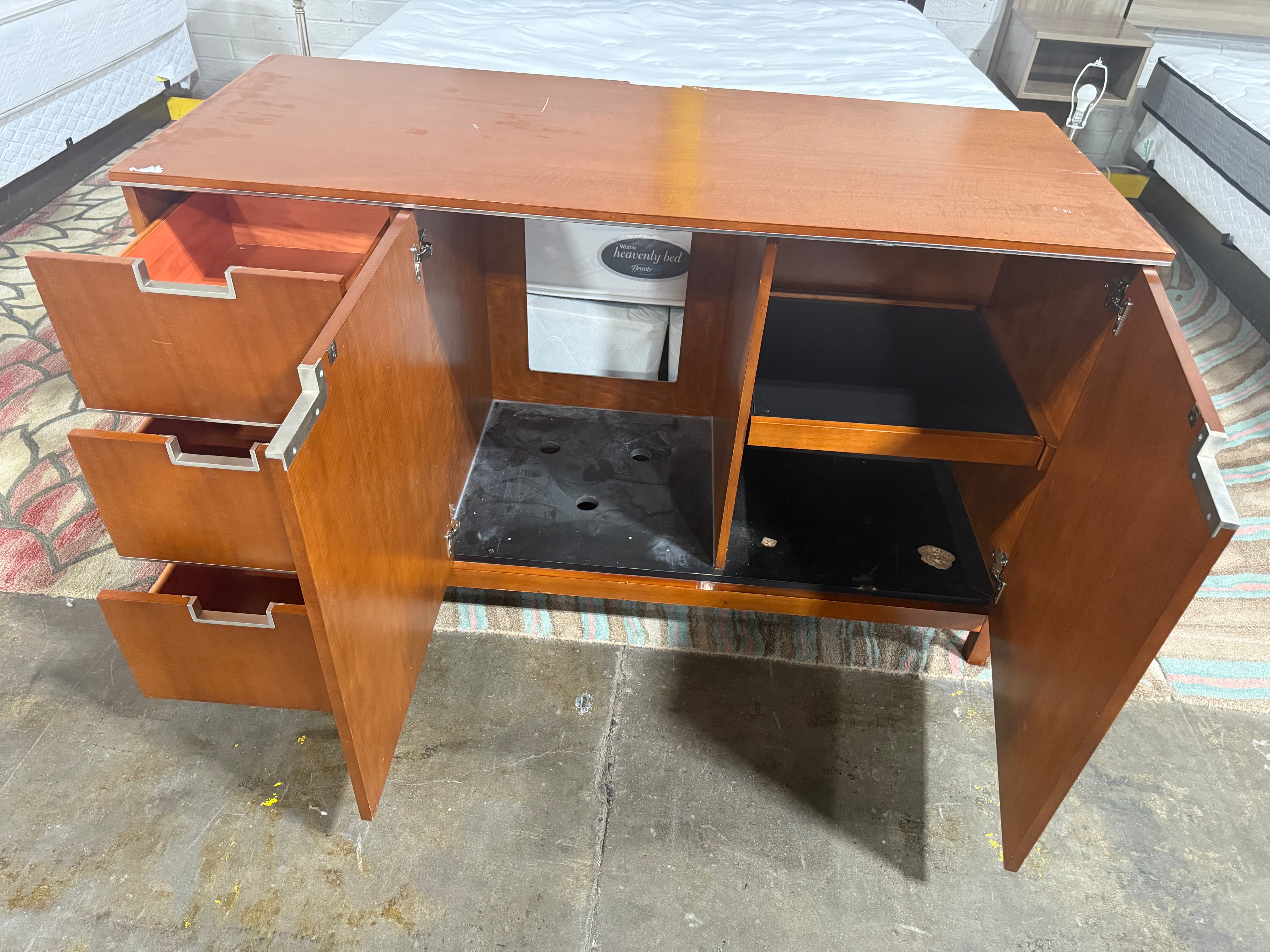Side profile of Fairmont Designs wooden dresser 60 inches wide with modern lines and durable hotel construction.