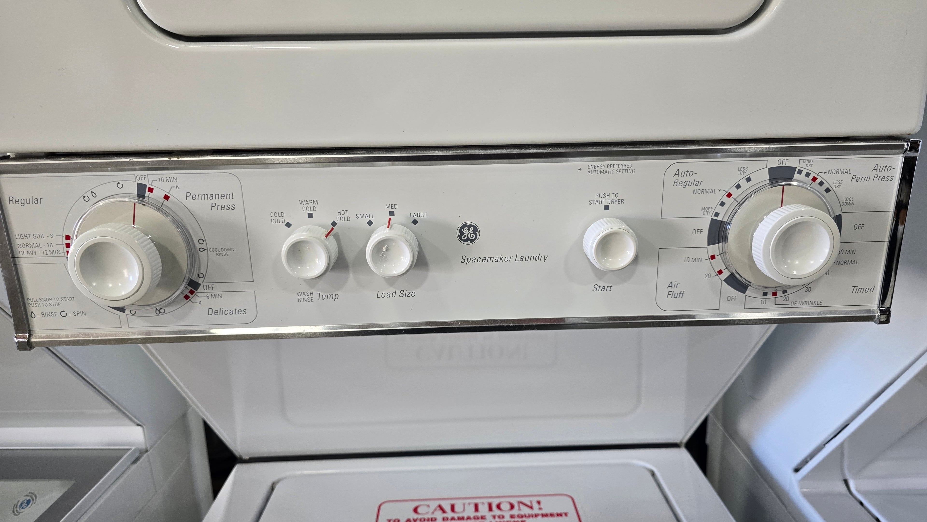 2011 GE Spacemaker white stacked laundry unit with top load dryer, compact design