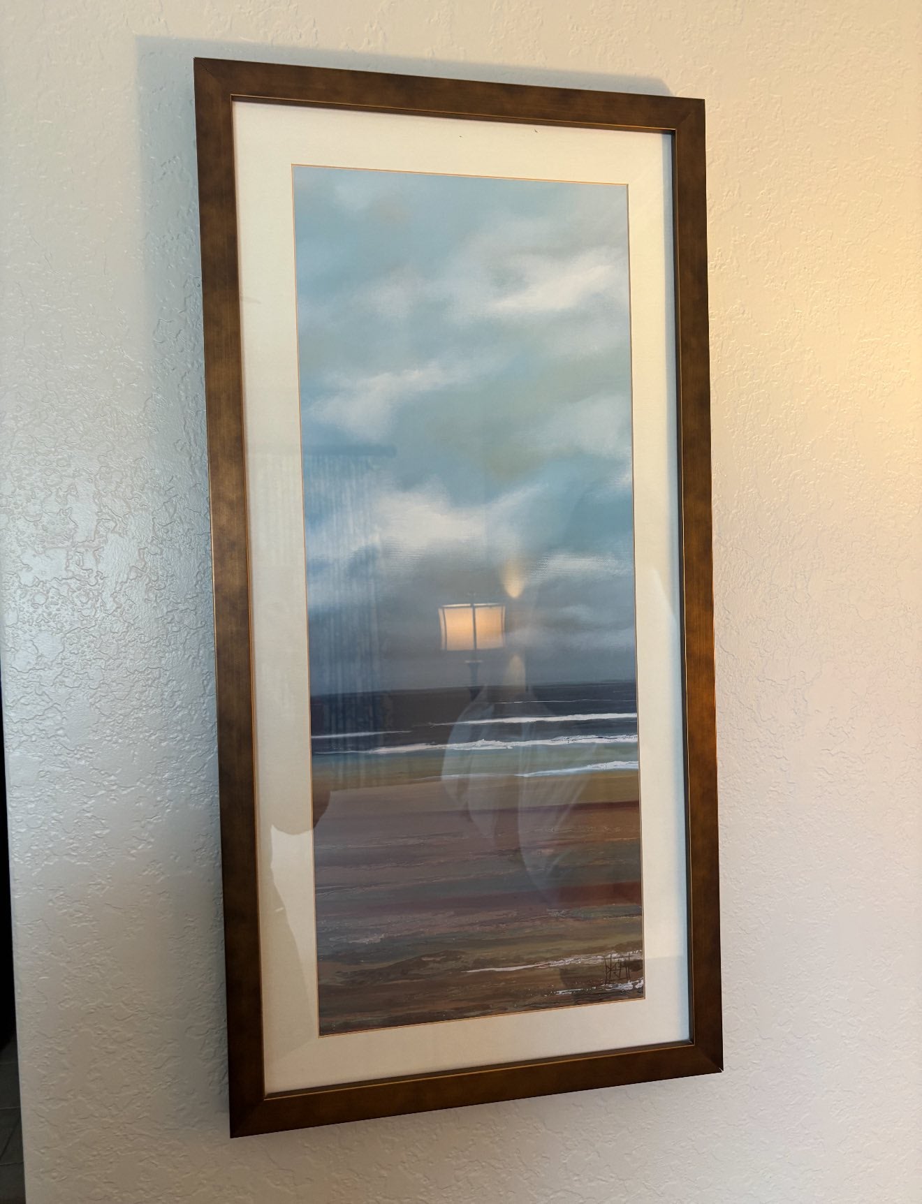 Beach artwork with wooden frame from Reunion Resort Kissimmee FL hotel furniture liquidation package