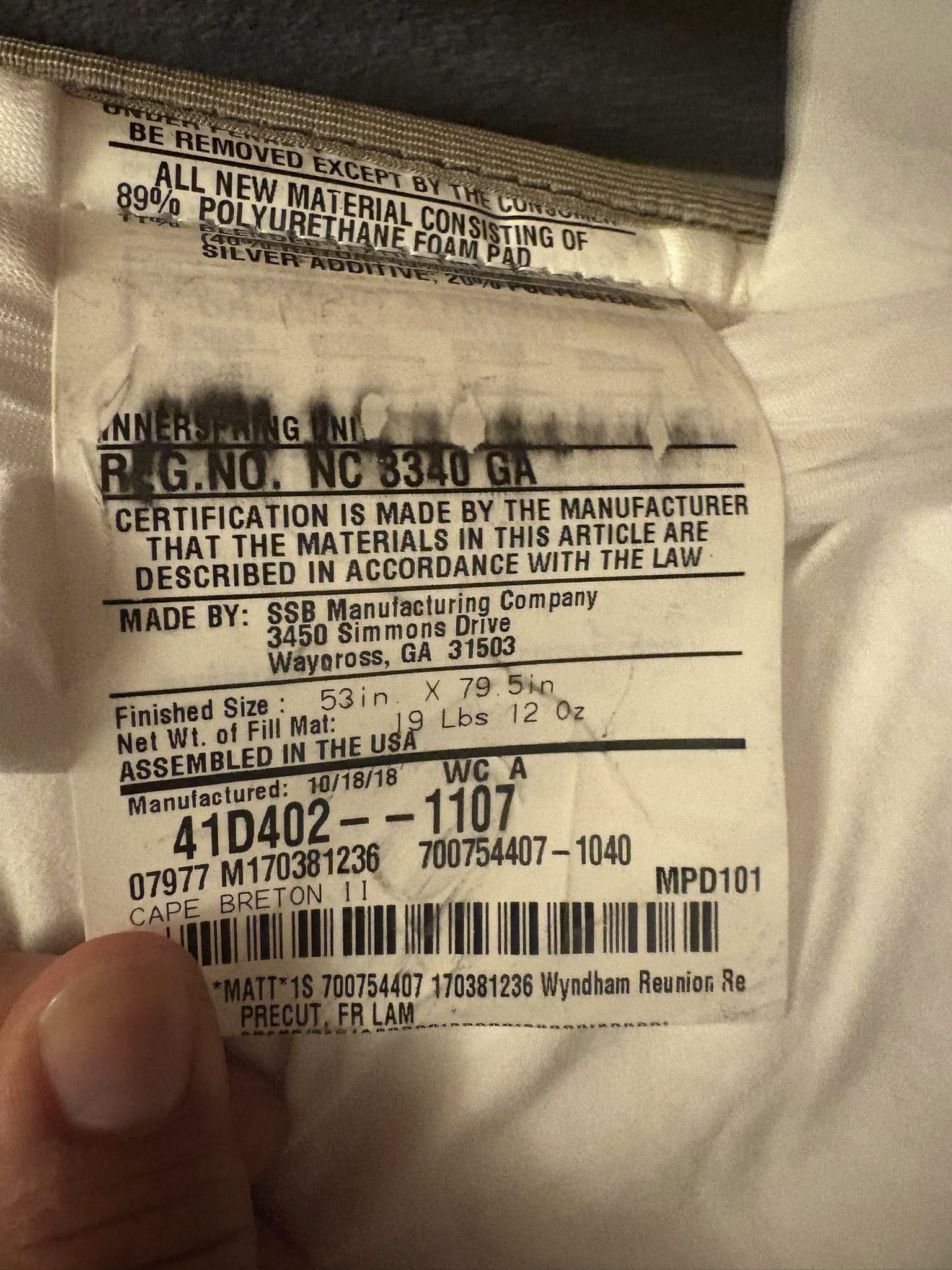 Reunion Resort mattress tag showing 2018 model details from hotel liquidation furniture package