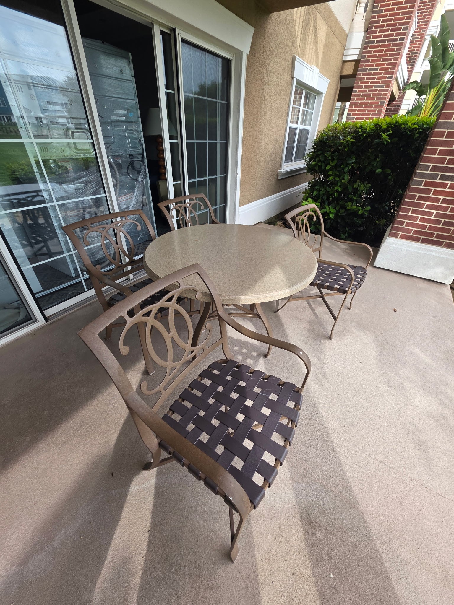 Reunion Resort patio set with lounge chairs, tea table and dining furniture, available through Southern Hospitality Liquidation