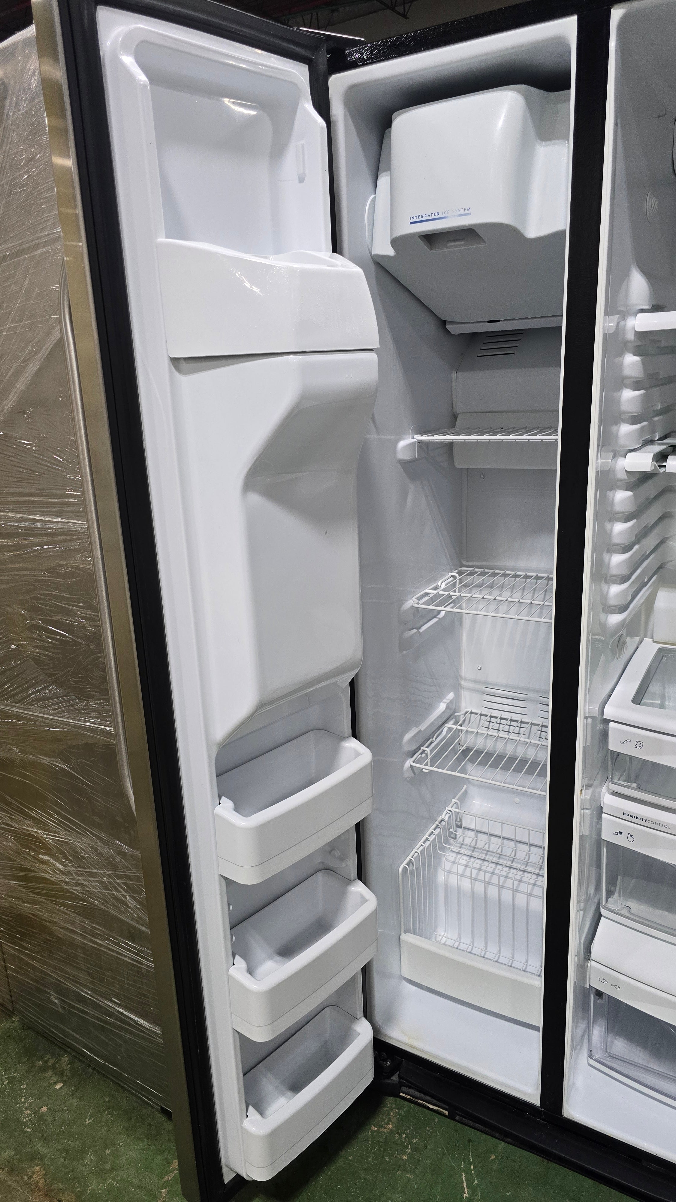 SHL interior of GE side-by-side refrigerator/freezer, used and in good condition