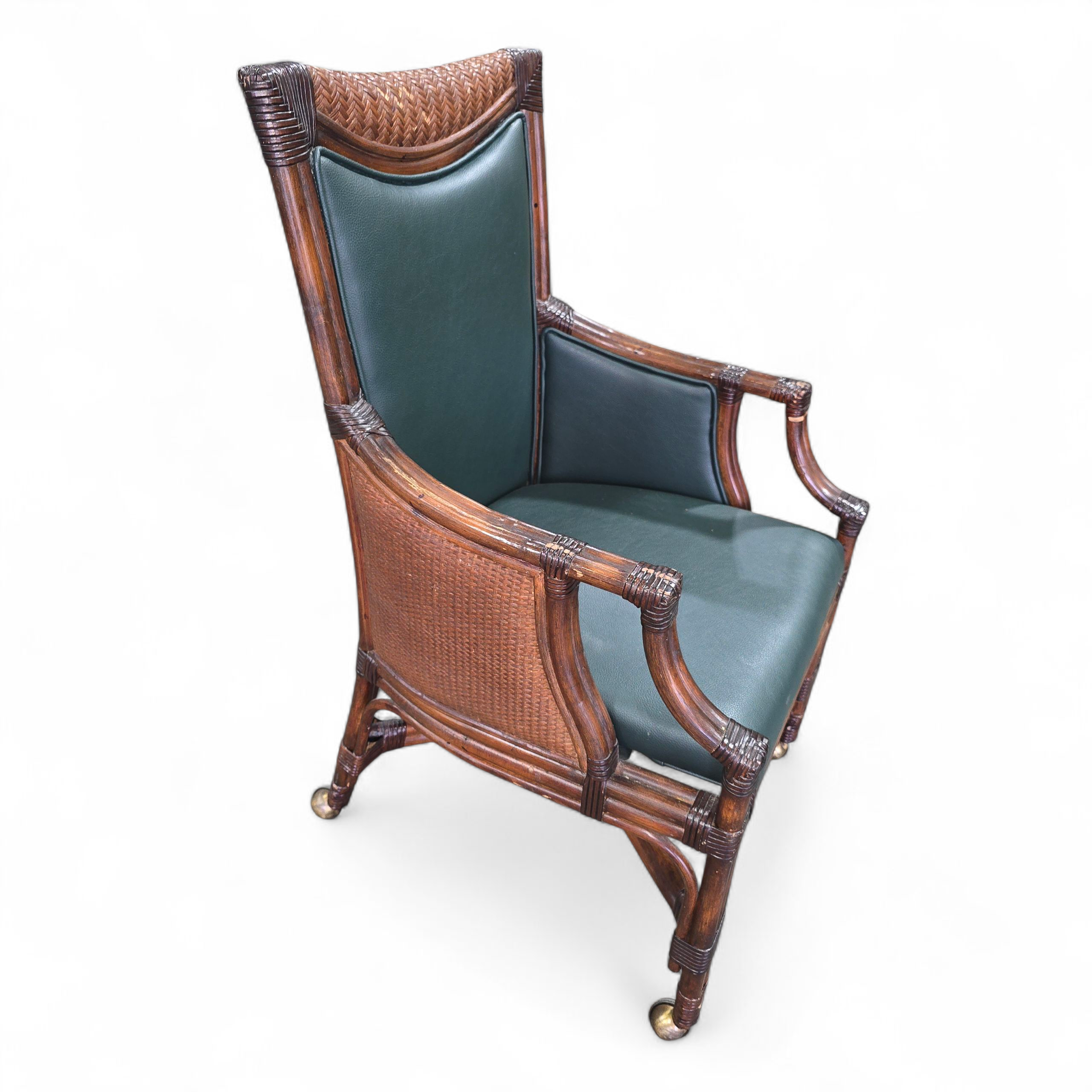 SHL side view of rattan rolling chair with dark green vinyl, used and in good condition