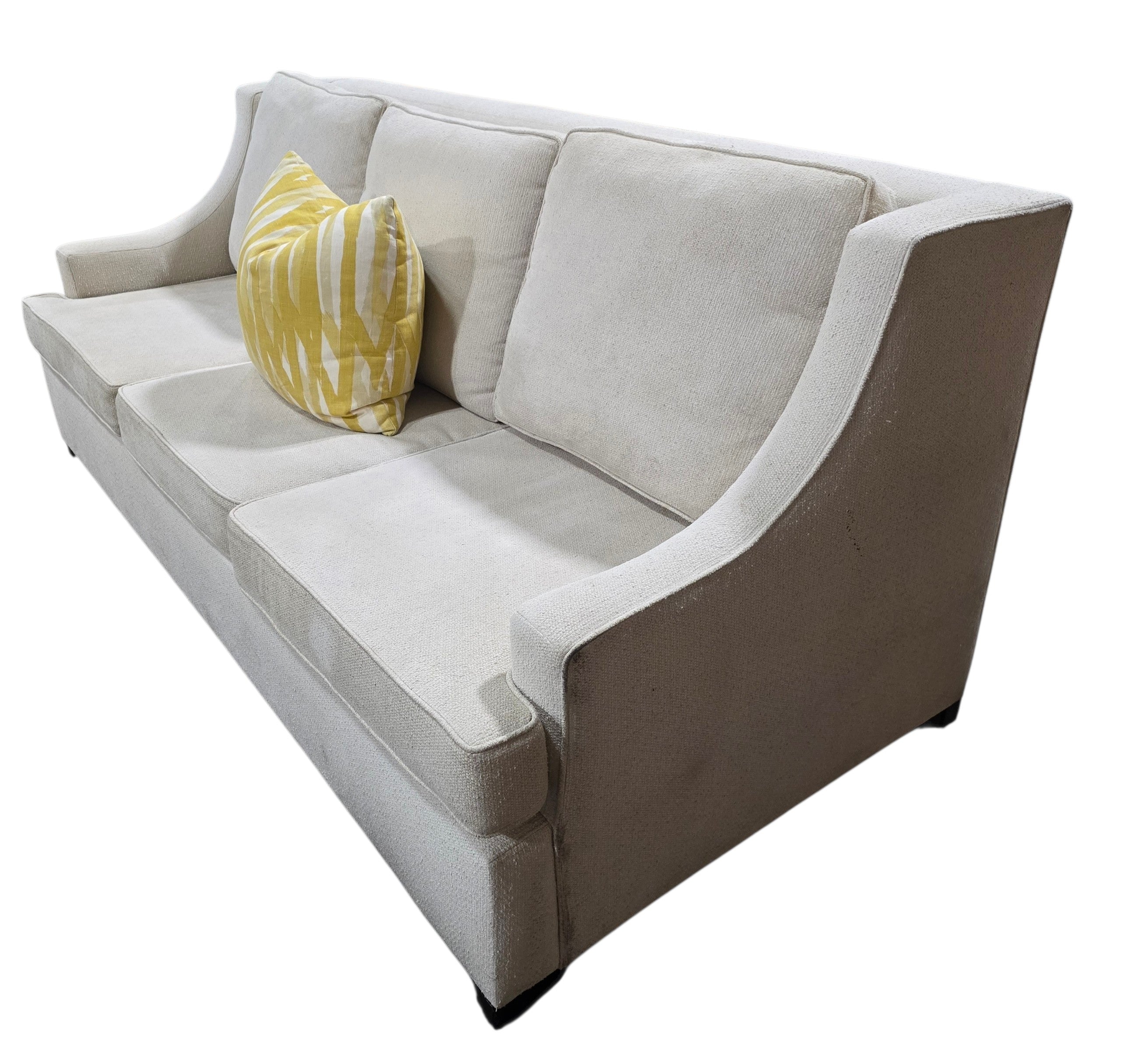 Angled view of a used Lily Jack cream upholstered queen sleeper sofa sourced from an upscale resort by Southern Hospitality Liquidation.