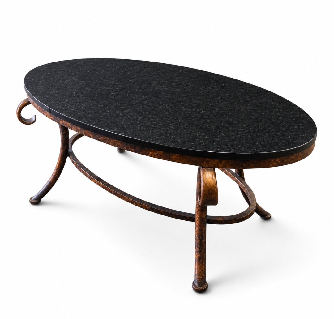 Used black granite top coffee table with bronze metal base, 38 x 22 x 18 inches, SHL