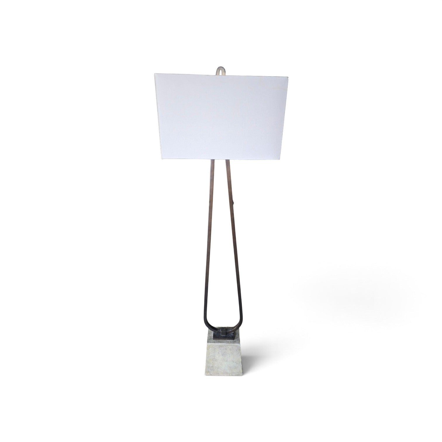 Used modern floor lamp with dark metal loop frame and stone base from Southern Hospitality Liquidation.