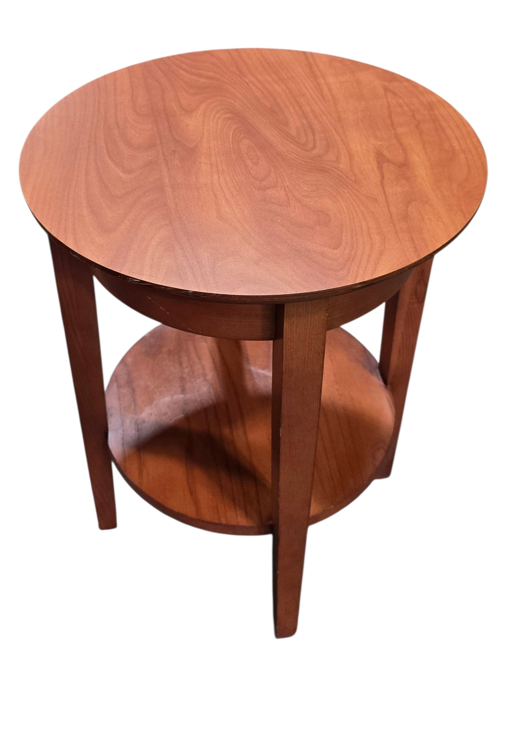 Used round wood end table with lower storage shelf, angled view, at Southern Hospitality Liquidation in Cartersville, GA.