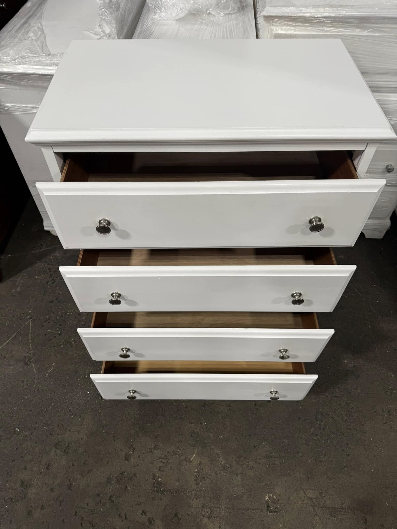 White 4-drawer chest with drawers open, coastal farmhouse furniture style