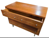 Wooden 3-drawer dresser with drawers open, functional storage solution from SHL