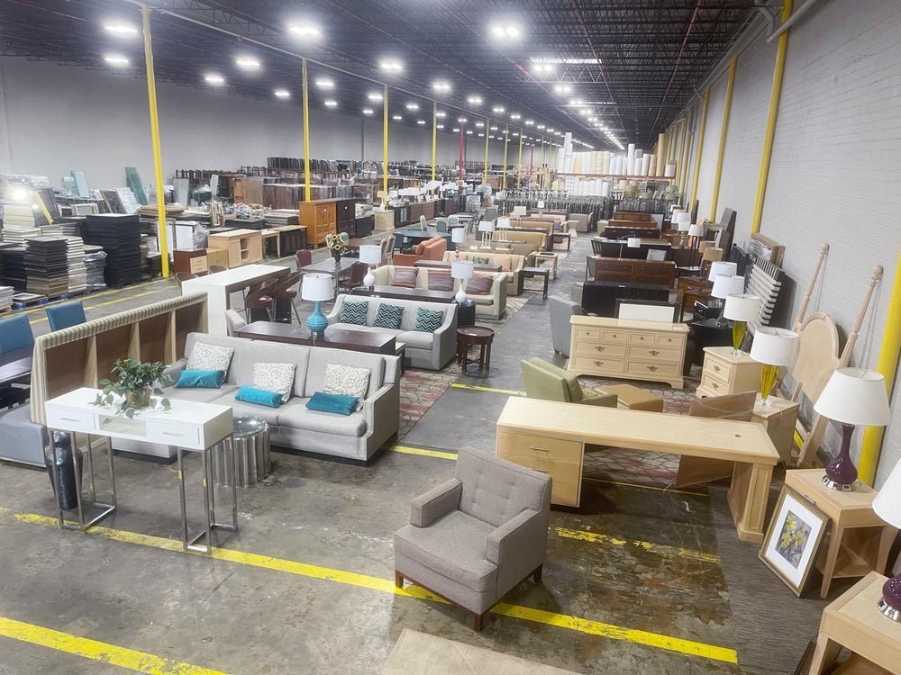 Southern Hospitality Liquidation repurposed hotel furniture stacked in warehouse, kept out of landfills and ready for resale