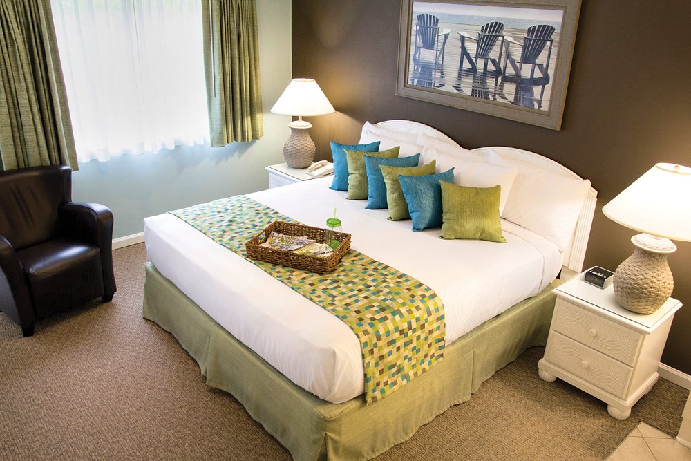 Front view of Grand Palms hotel furniture package featuring white guest room furniture available through Southern Hospitality Liquidation.