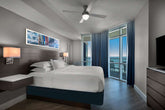 Hilton Grand Vacations floating nightstands with wall sconces – pre-owned hotel furniture liquidation