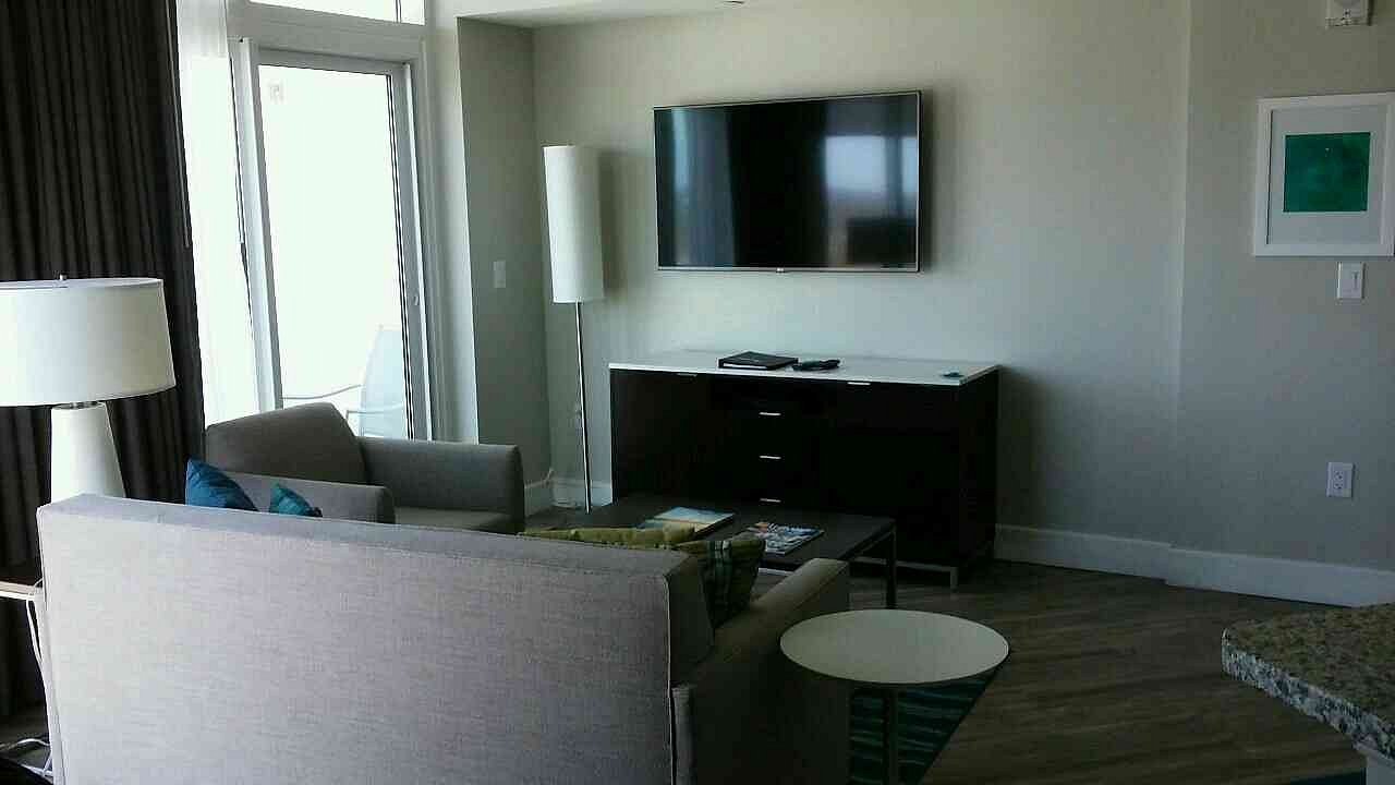 Pre-owned Hilton Grand Vacations 4-drawer dresser with cabinet – included in liquidation hotel room package
