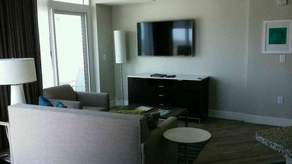 Pre-owned Hilton Grand Vacations 4-drawer dresser with cabinet – included in liquidation hotel room package