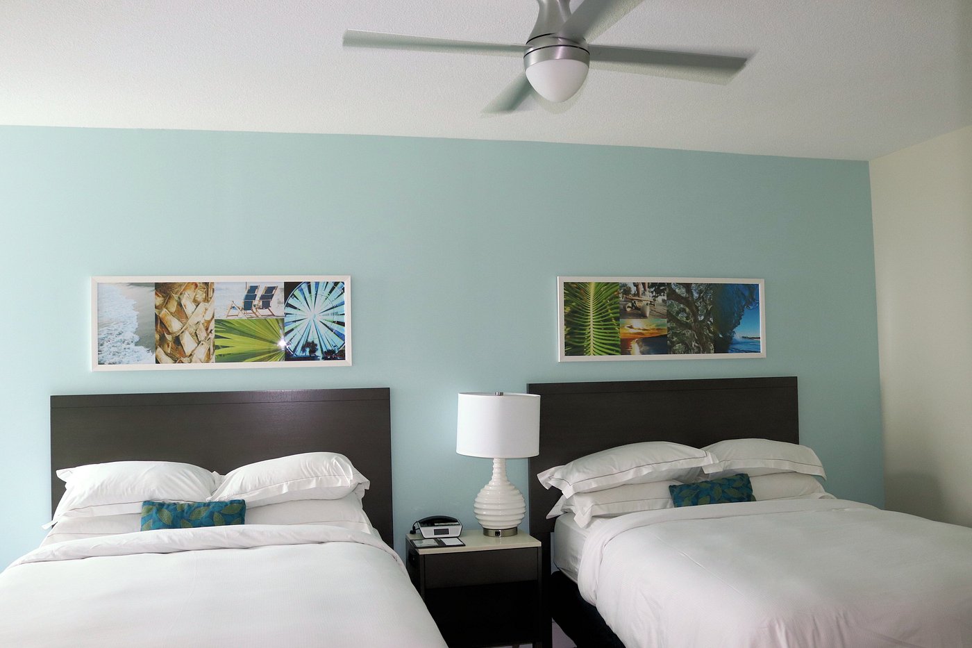 Hilton Grand Vacations queen room furniture package – mattress, headboard, nightstands, accent chair, floor lamp, and wall art