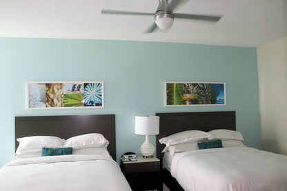 Hilton Grand Vacations queen room furniture package – mattress, headboard, nightstands, accent chair, floor lamp, and wall art