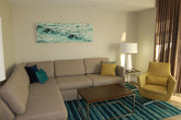 Pre-owned Hilton Grand Vacations sectional sleeper sofa in hotel living room – durable, stylish, and affordable furniture liquidation
