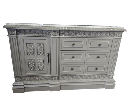 Front view of carved wood 3 drawer TV dresser with cabinet