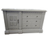 Front view of carved wood 3 drawer TV dresser with cabinet