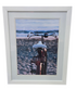 Beach cruiser bike wall art facing the ocean in a white frame, used and in good condition