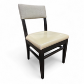 SHL side view of beige vinyl dining chair with half-back design, used and in good condition