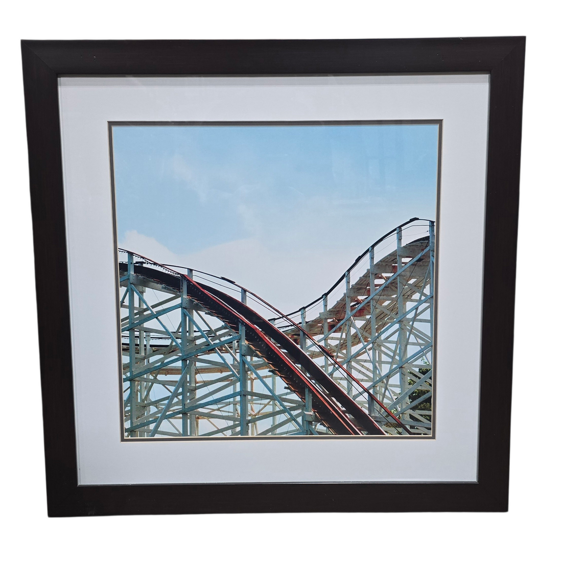 Black framed print of vintage roller coaster measuring 29.5 x 29.5, used and in good condition