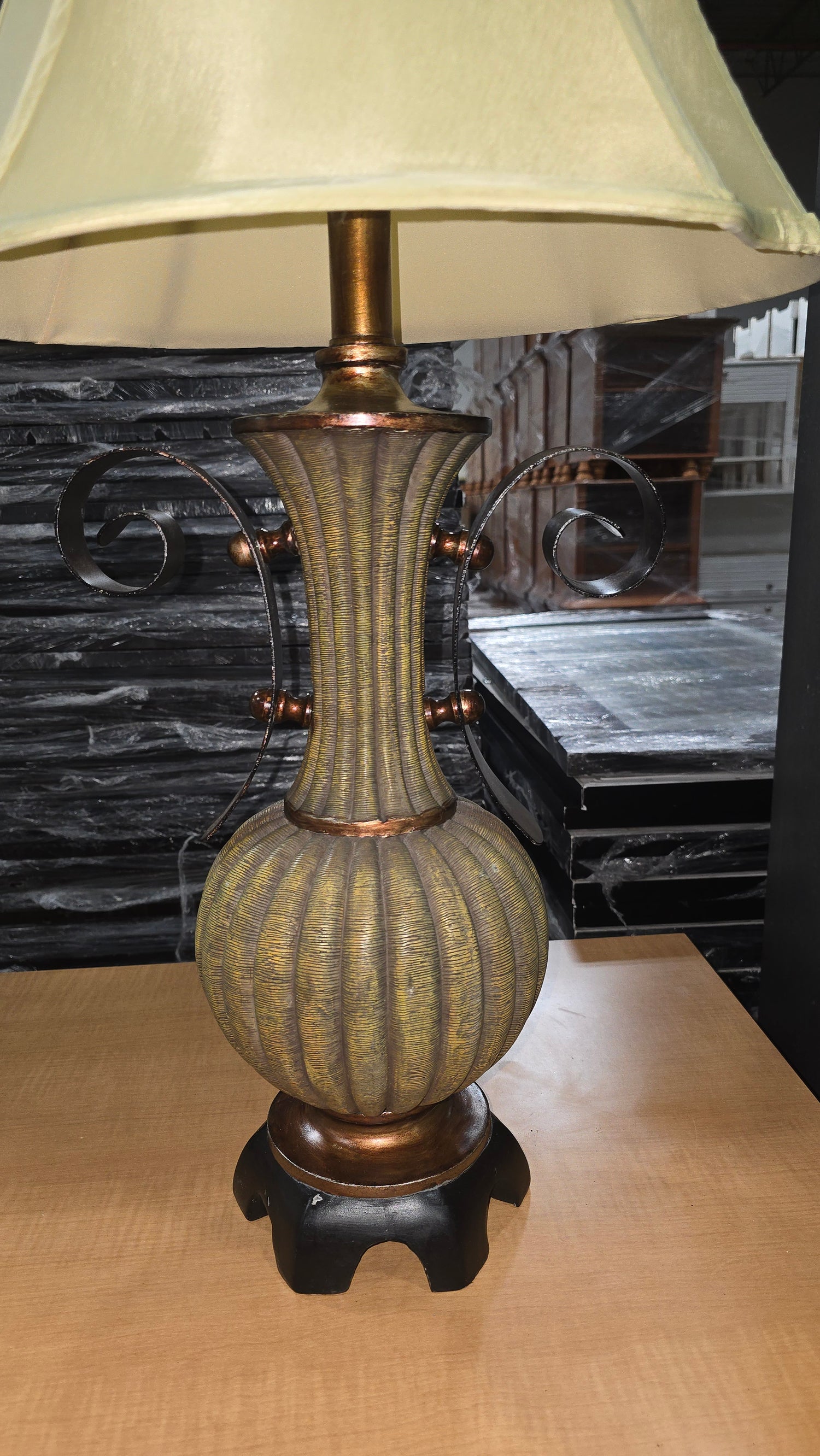 Close-up of bronze urn-style lamp base detail