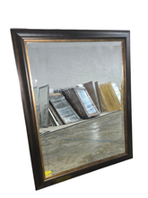 Wall mirror with dark brown frame and bronze trim 27.5 x 39.5 used in good condition