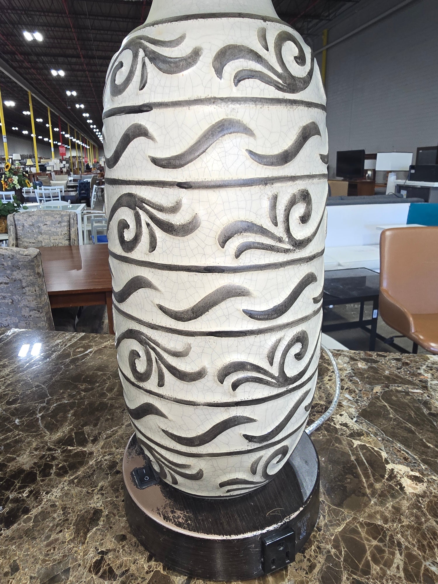 Front view of white ceramic lamp with brown pattern