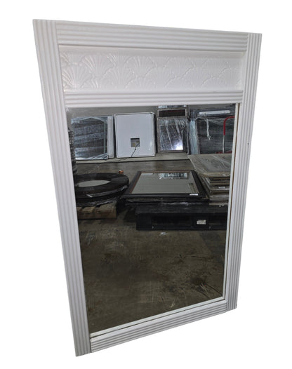 Coastal white shell motif wall mirror measuring 27.5 x 44 inches