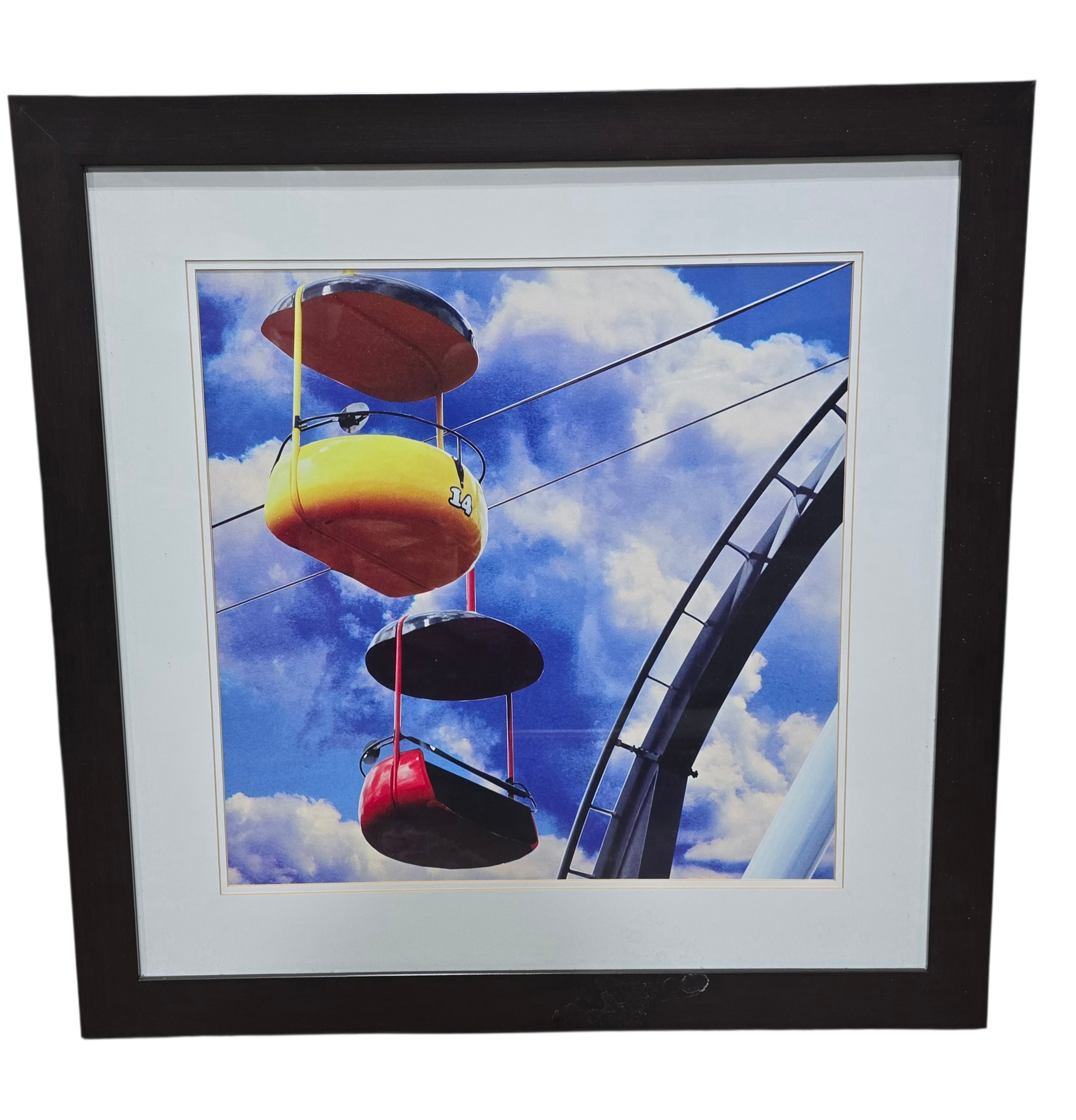 Framed wall art of colorful gondola ride cars against blue sky, used and in good condition