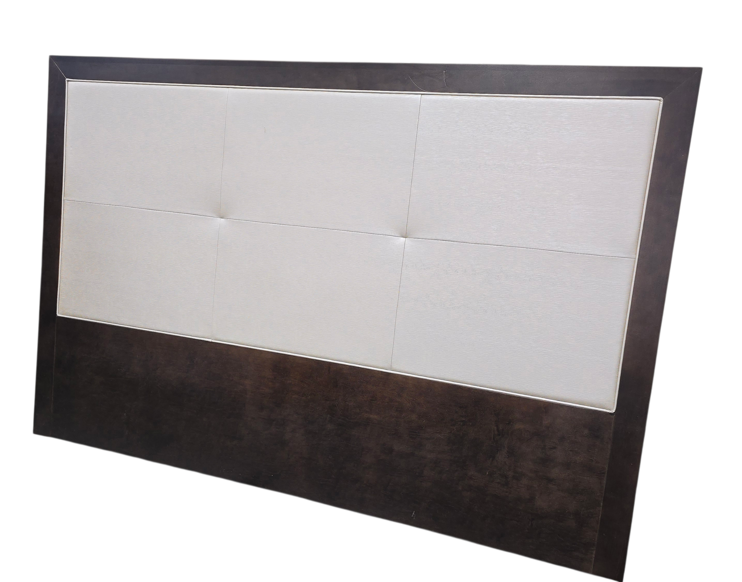 Cream colored padded headboard with dark wood frame, used and in good condition