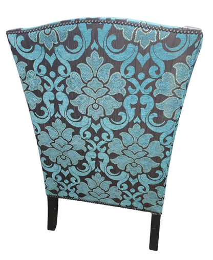 Close-up of damask upholstery detail on chair back