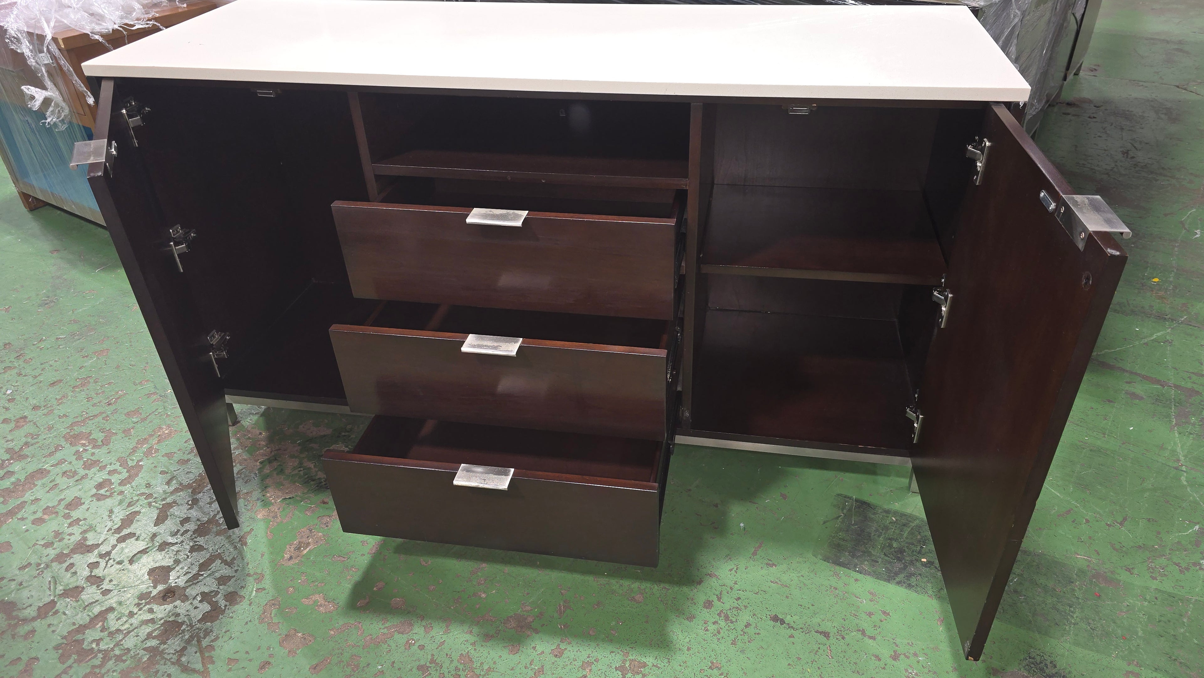 SHL open cabinet storage detail on dark brown dresser