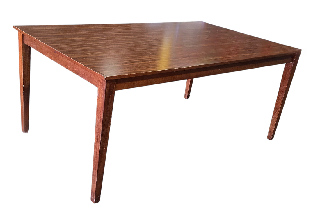 Close-up of dining table leg detail showing minor scratches