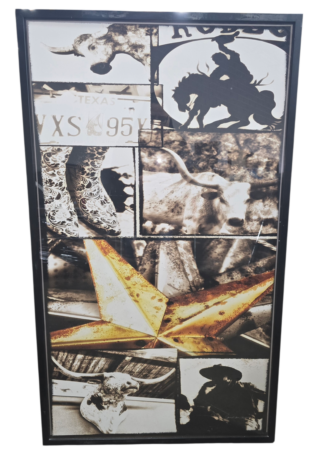 Framed Texas themed collage wall art featuring cowboy boots longhorns and cowboy silhouette measuring 28 x 48, used and in good condition
