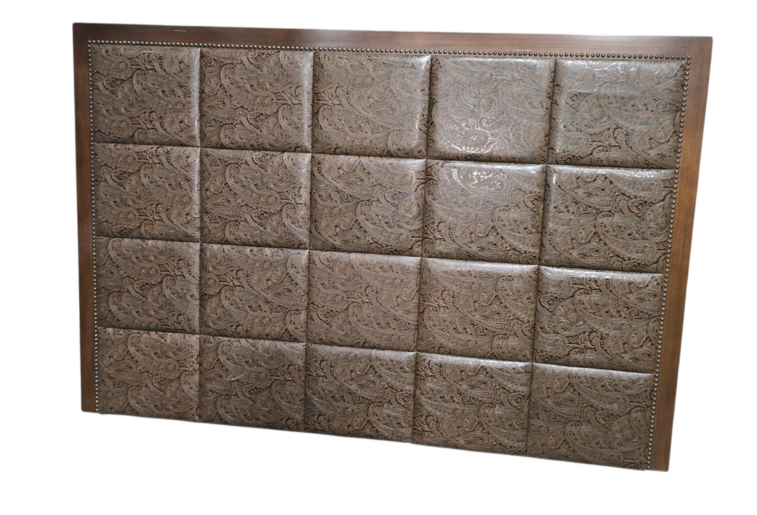 Front view of large tufted panel headboard with patterned upholstery
