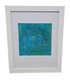 Matted wall art in white frame measuring 17.5 x 21.5, used and in good condition