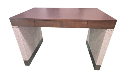 Front view of beige desk with decorative paisley accents