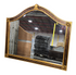 Close up of gold frame detail with decorative corner elements