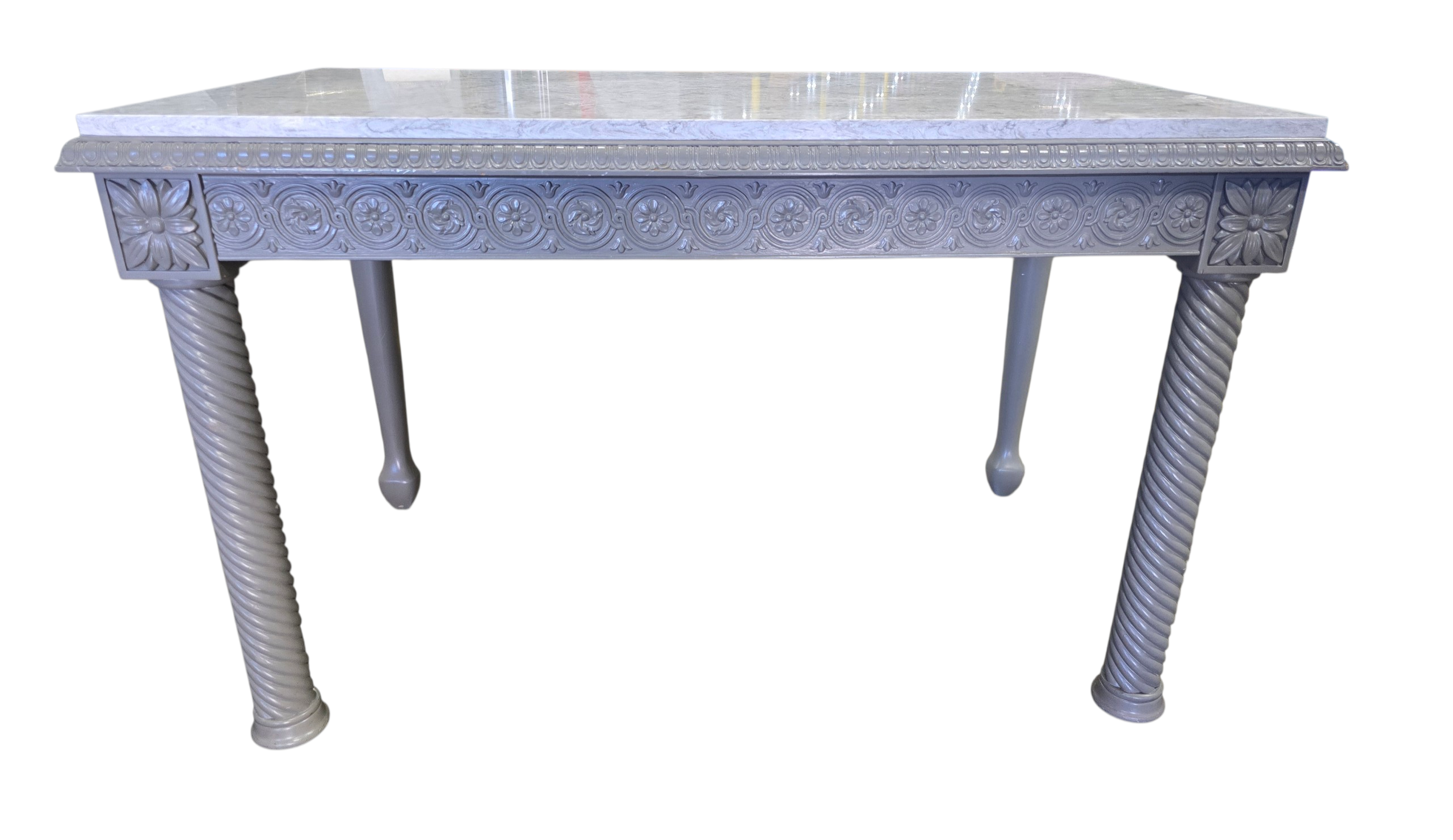 Front view of gray painted carved wood desk with granite surface