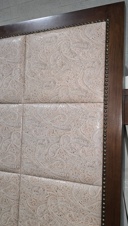 Close-up of paisley fabric detail on headboard