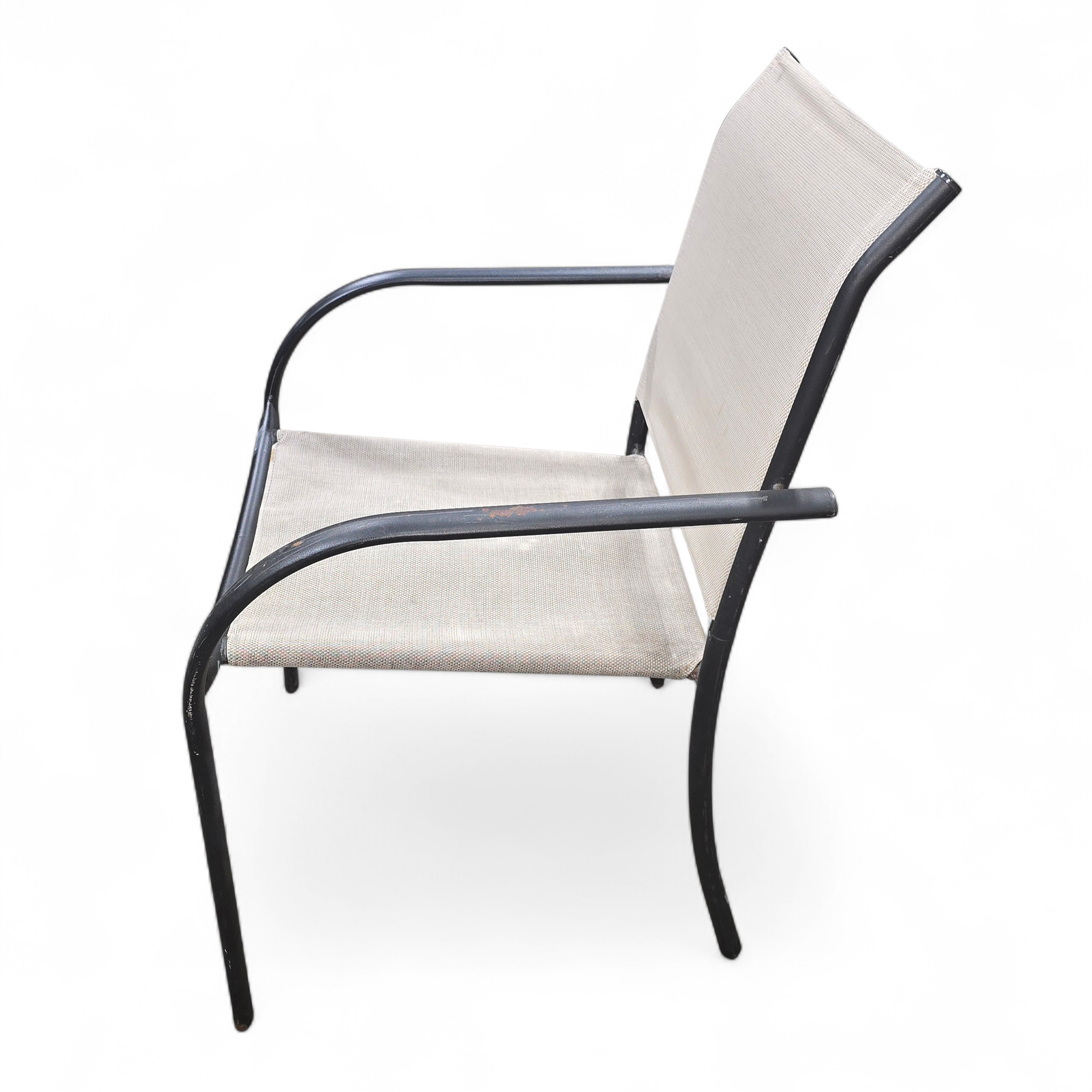 SHL angled view of outdoor patio chair with visible wear