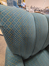 Accent chair with wooden legs and patterned upholstery